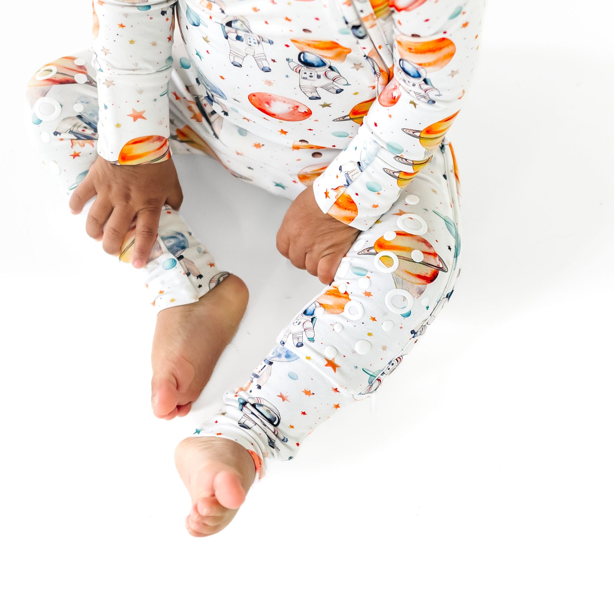 Kaizen Baby Astronaut Dreams Knee-Grip Footie bamboo pajamas - Cropped legs and hands, silicone grip dots on knees